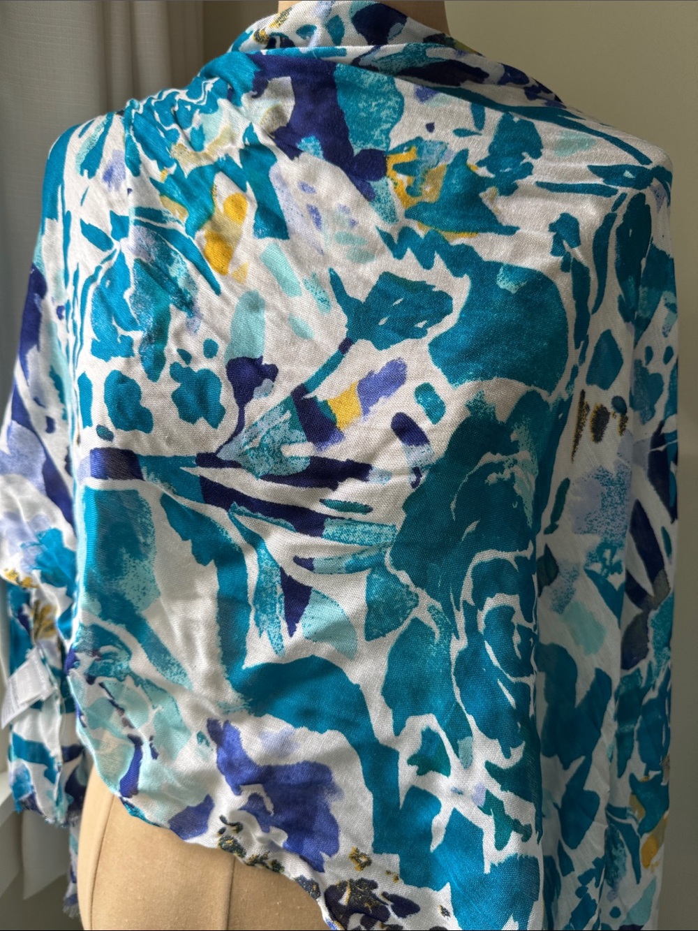 Chicos Modal and silk scarf in blue/green floral pattern.